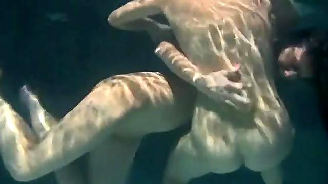 Girls grope and fondle underwater to arouse