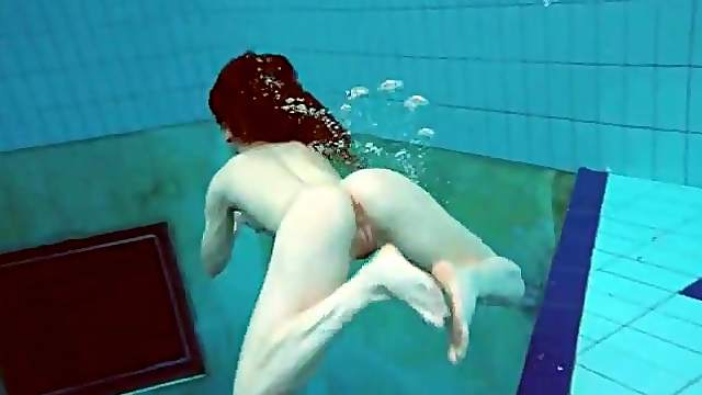 College girl goes swimming and strips underwater